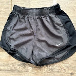 Black and gray Nike running shorts